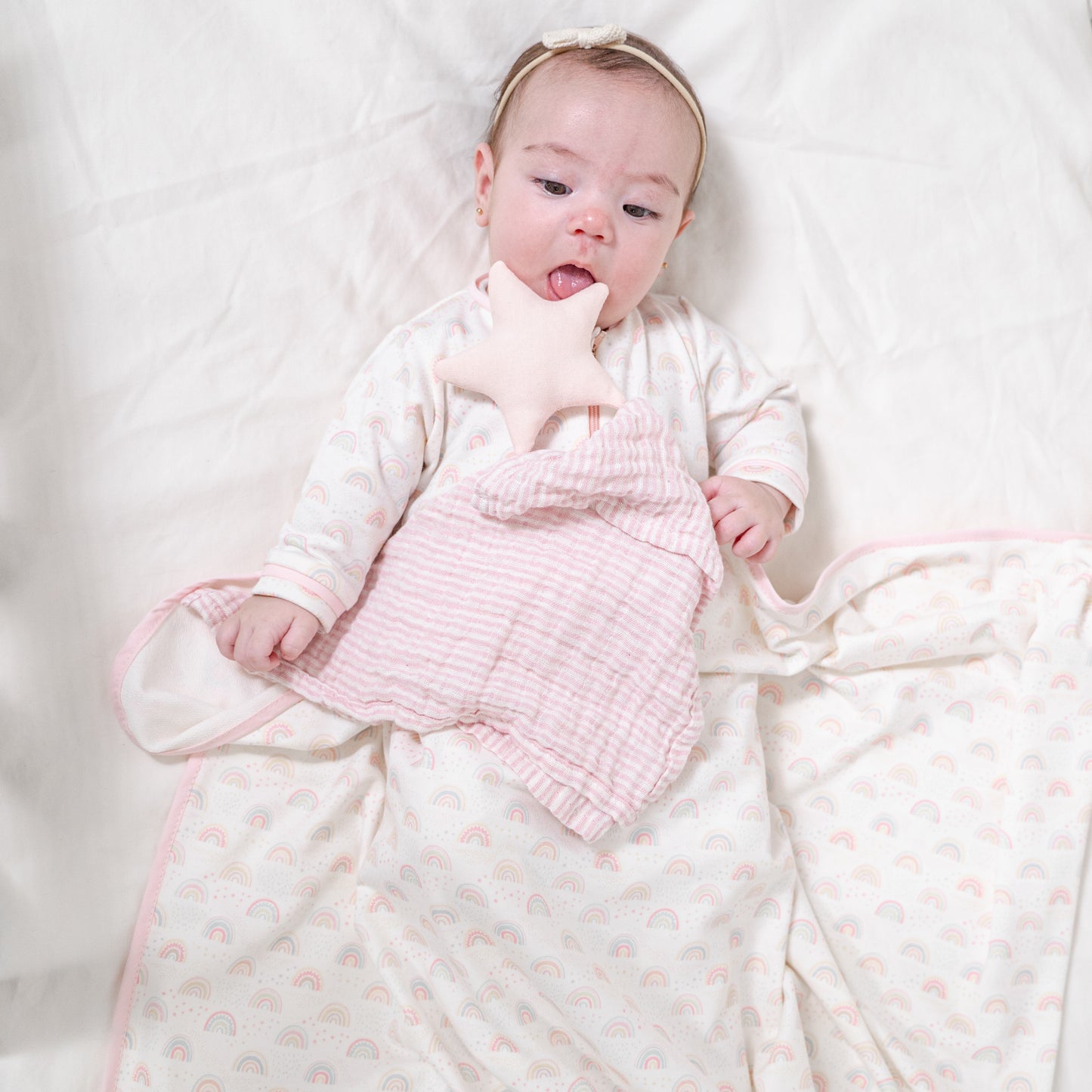 Set frazada con trapo de apego arcoíris rosa